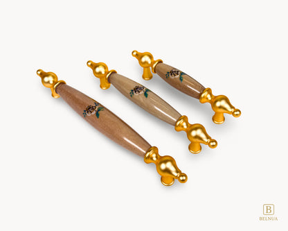 Styled composition of Lumora gold porcelain handles for cabinets and drawers